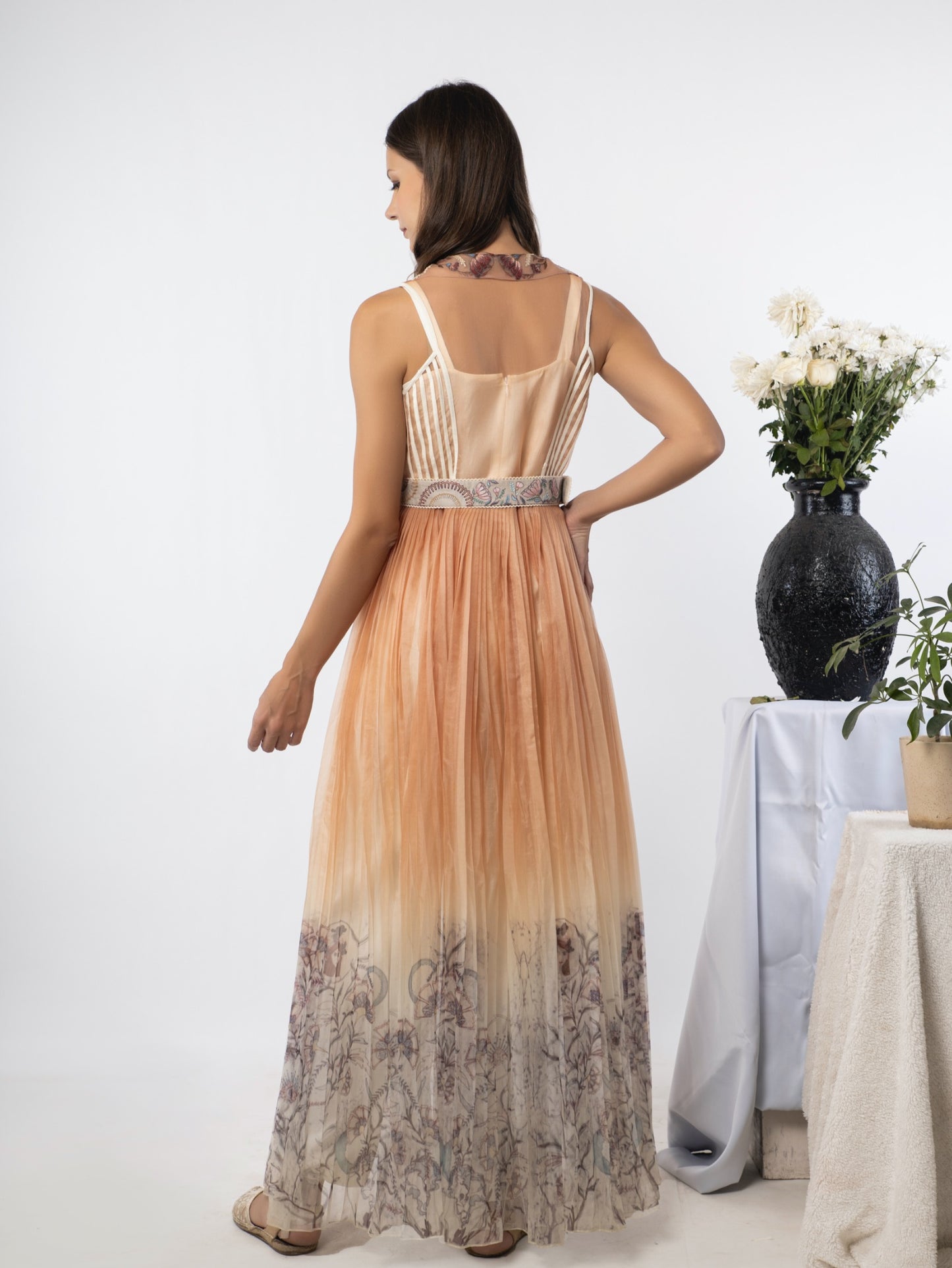 White jumpsuit with a sand-peach cape. image 3