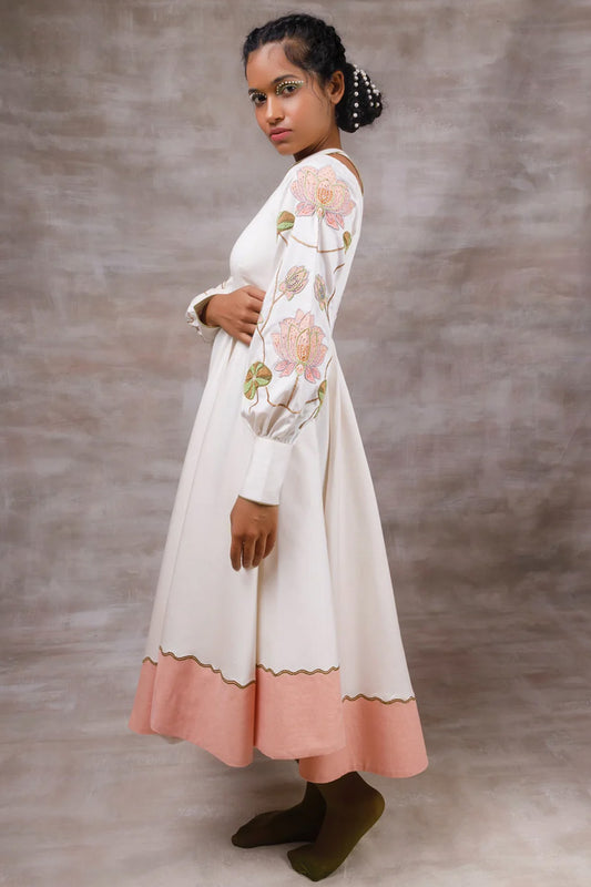 Off white drape dress with embroidered sleeves.