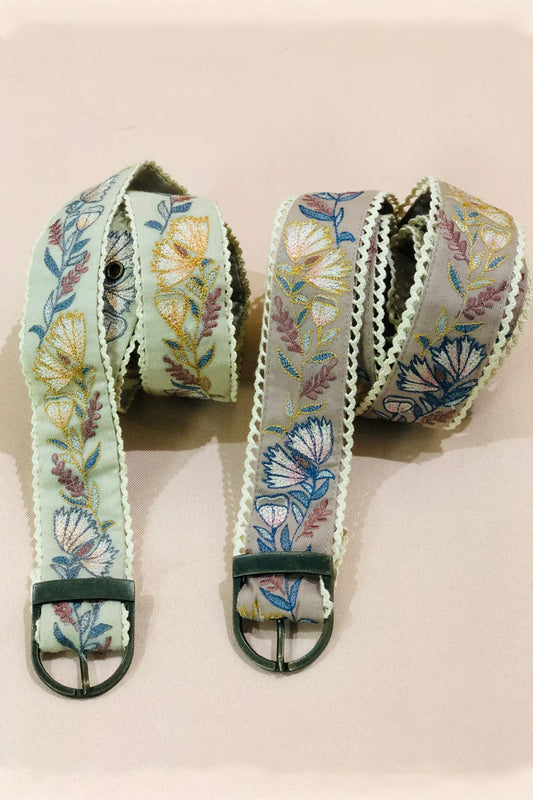 Green floral embroidered belt.