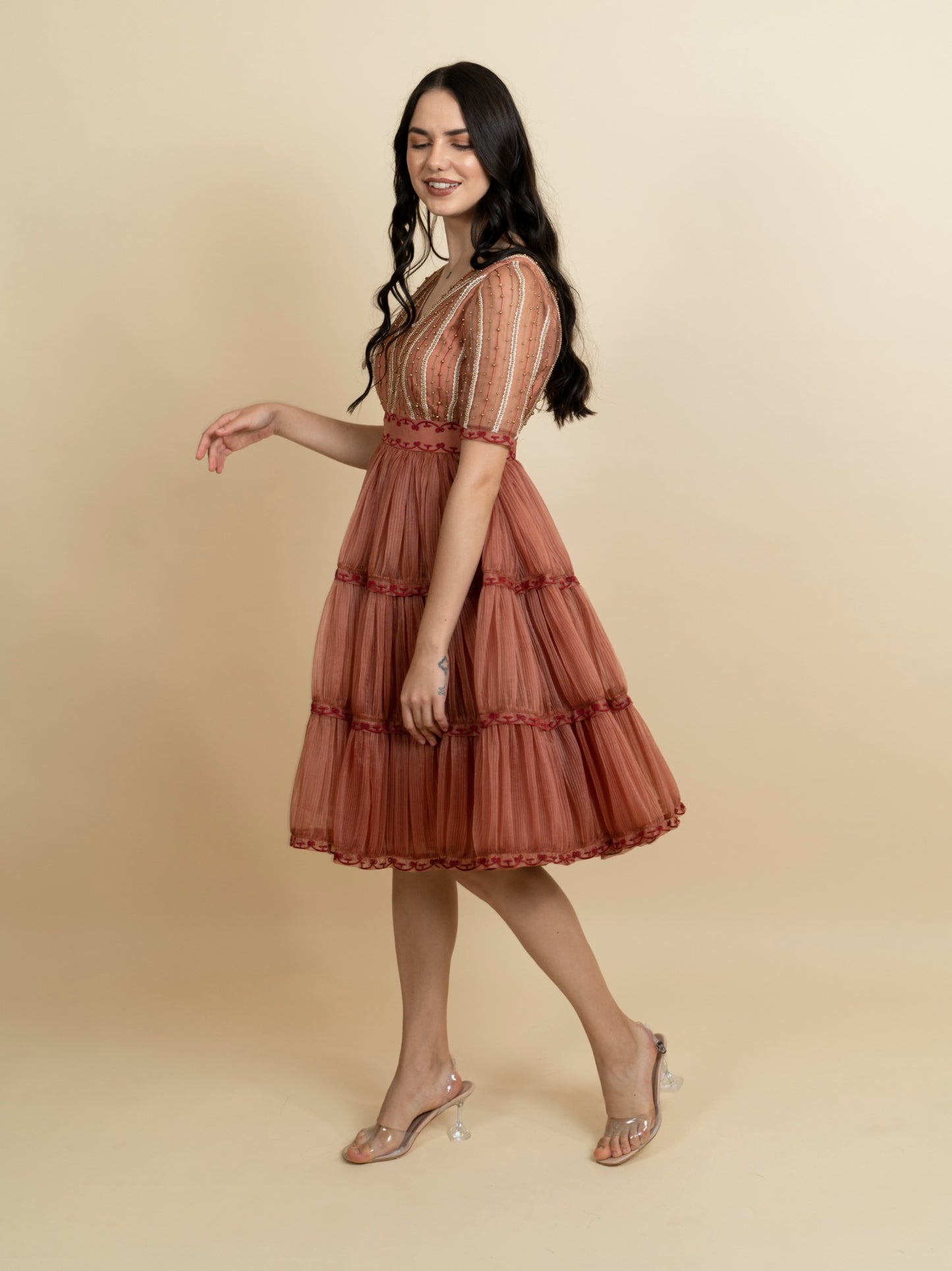 Golden galaxy embroidery in narrow pleated dress. image 1