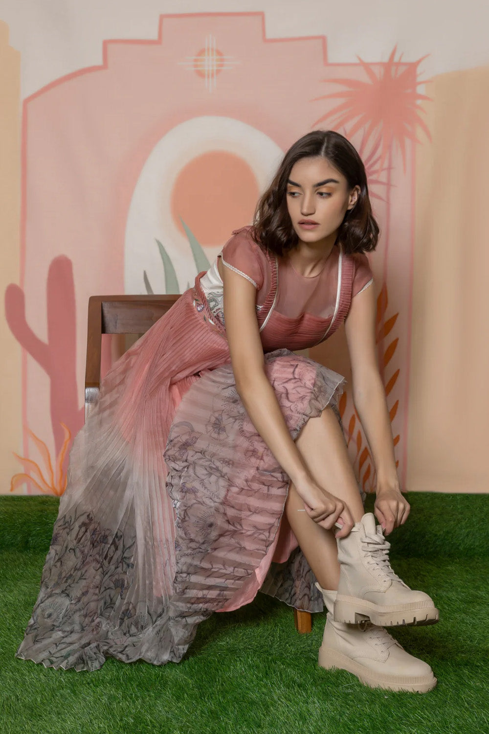 Pink organza print-pleated gown.