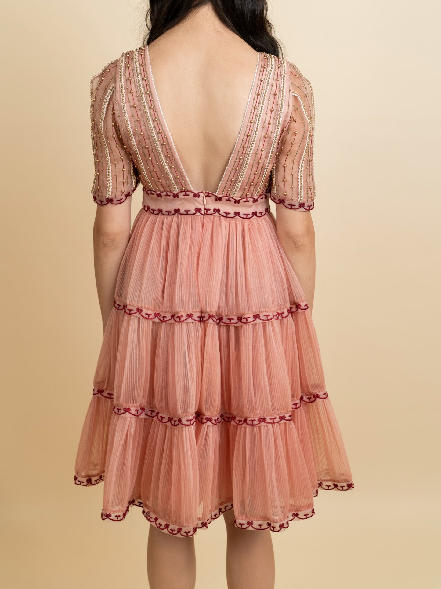 Golden galaxy embroidery in narrow pleated dress. image 3