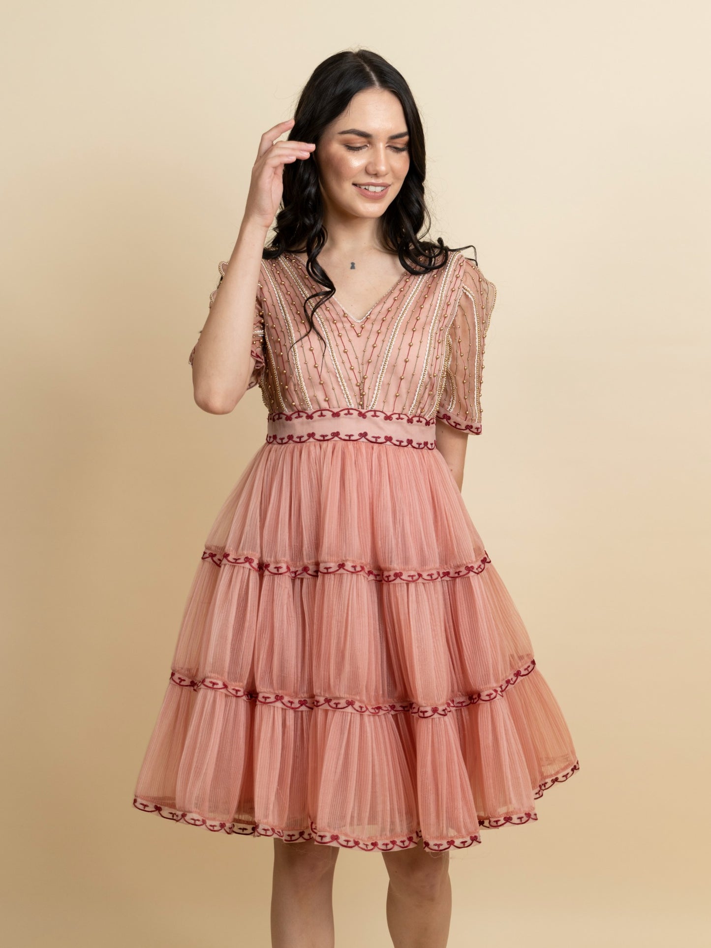 Golden galaxy embroidery in narrow pleated dress. image 2