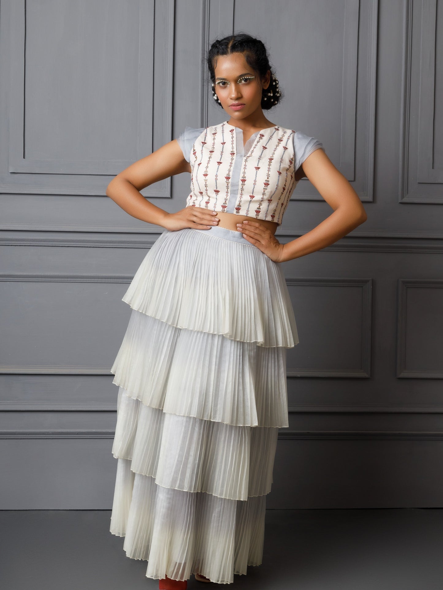 Embroidered top with multi layered pleated skirt. image 0