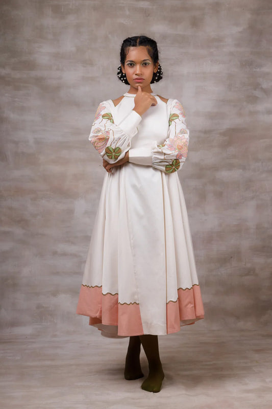 Off white drape dress with embroidered sleeves.