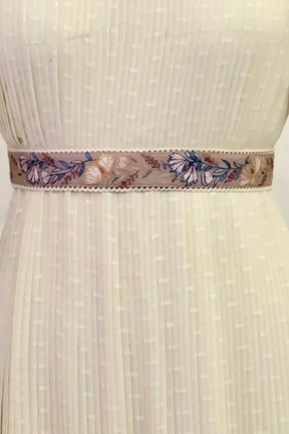 Green floral embroidered belt.