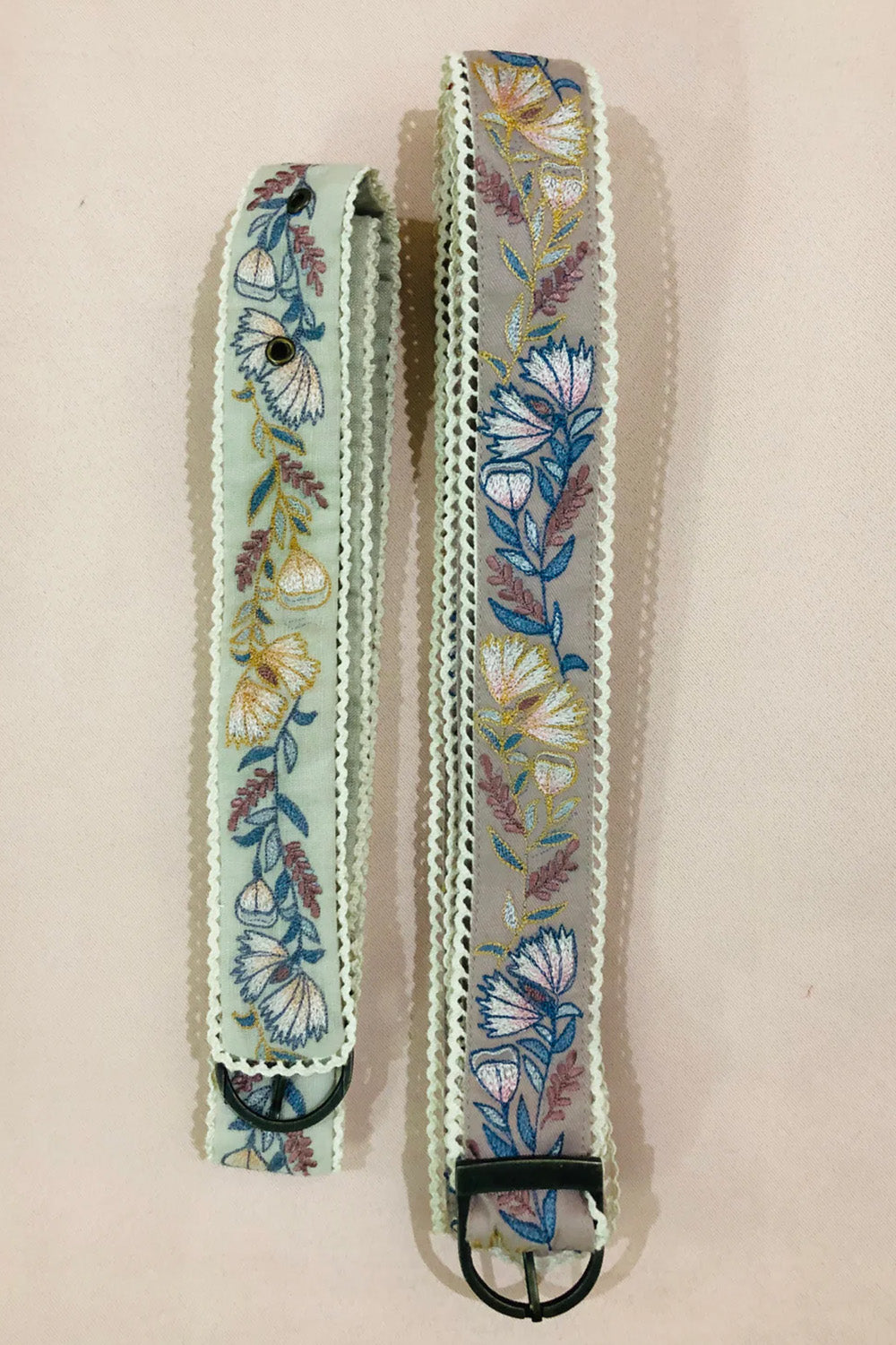 Green floral embroidered belt.