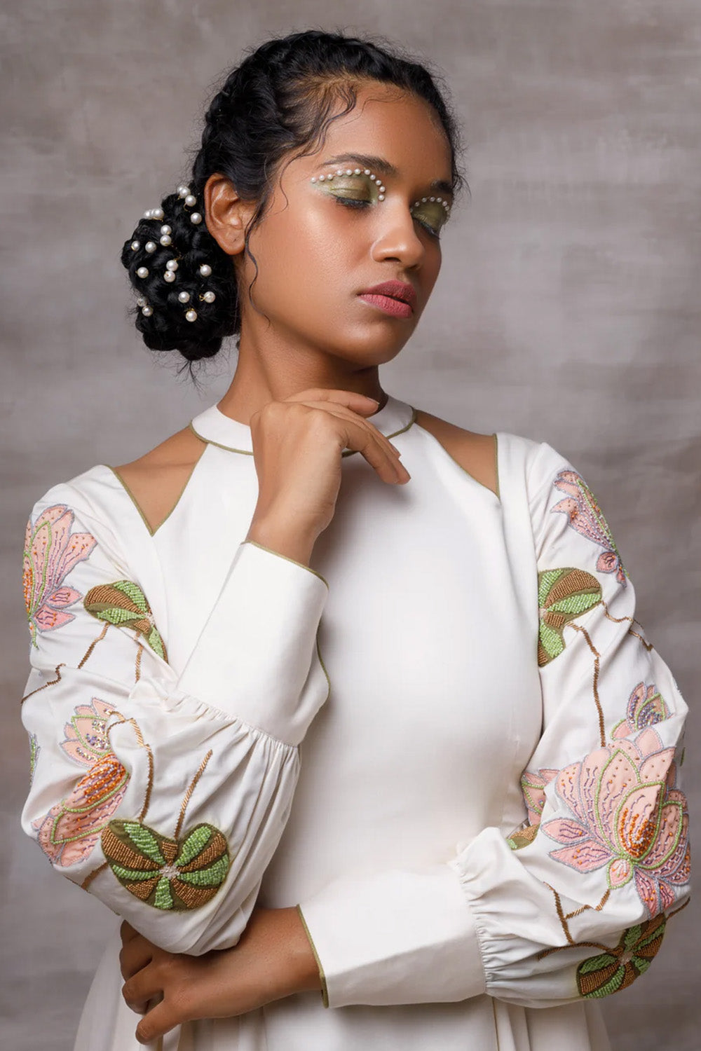 Off white drape dress with embroidered sleeves.