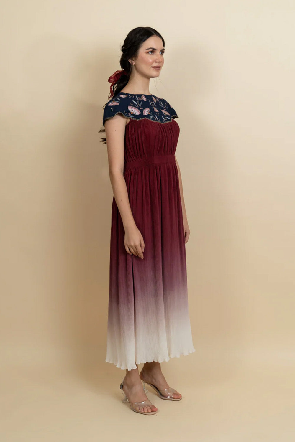 Floral embroidered neckline in a full length dress. (Blue)