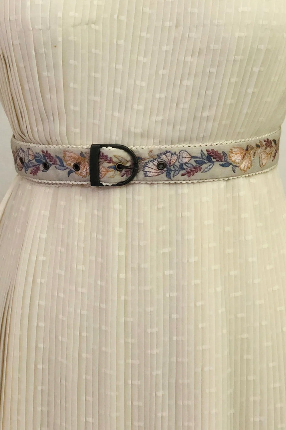 Green floral embroidered belt.