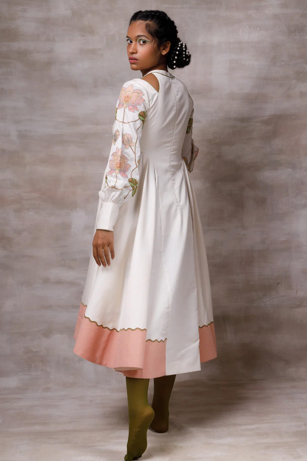 Off white drape dress with embroidered sleeves.