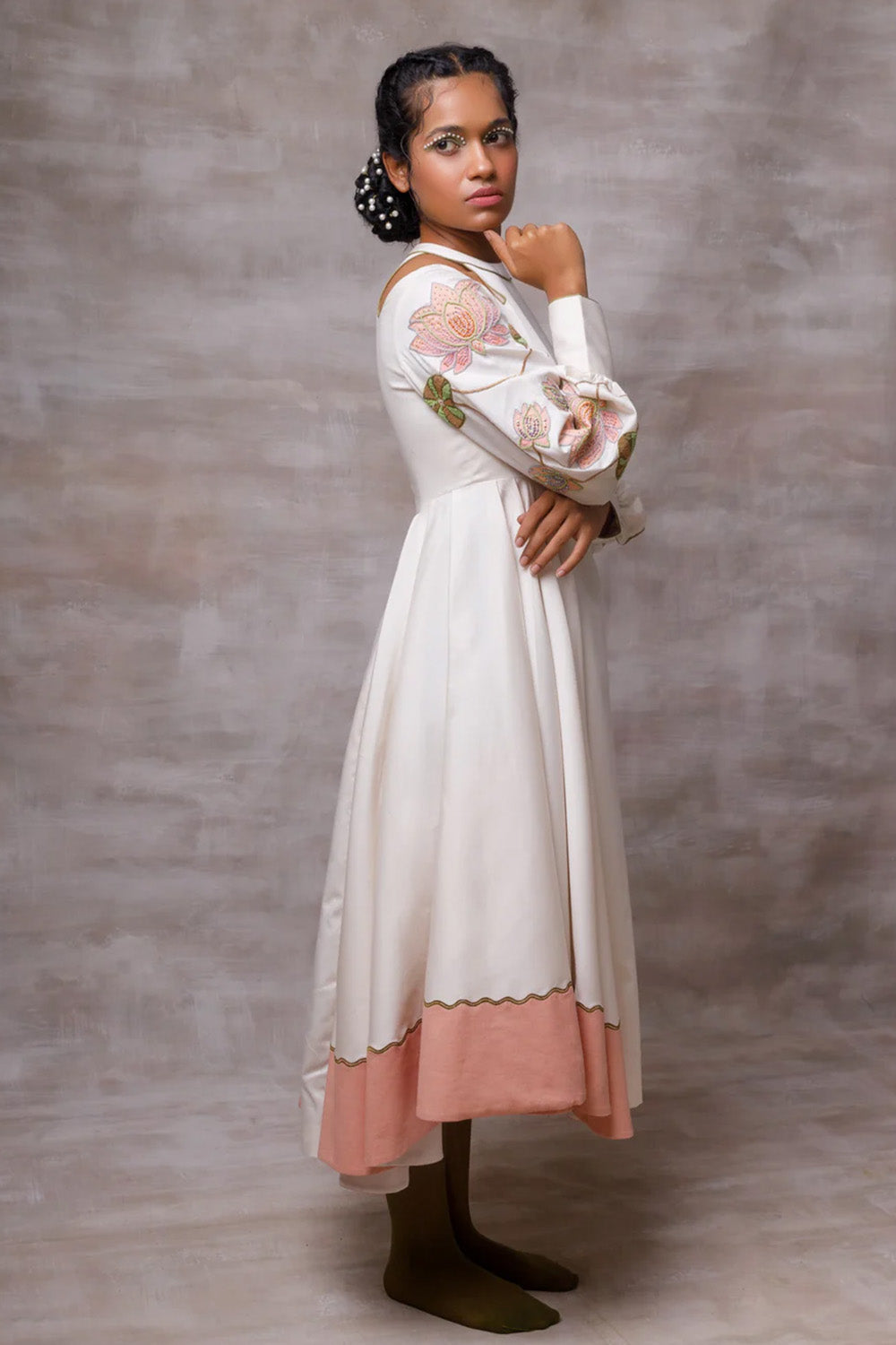 Off white drape dress with embroidered sleeves.