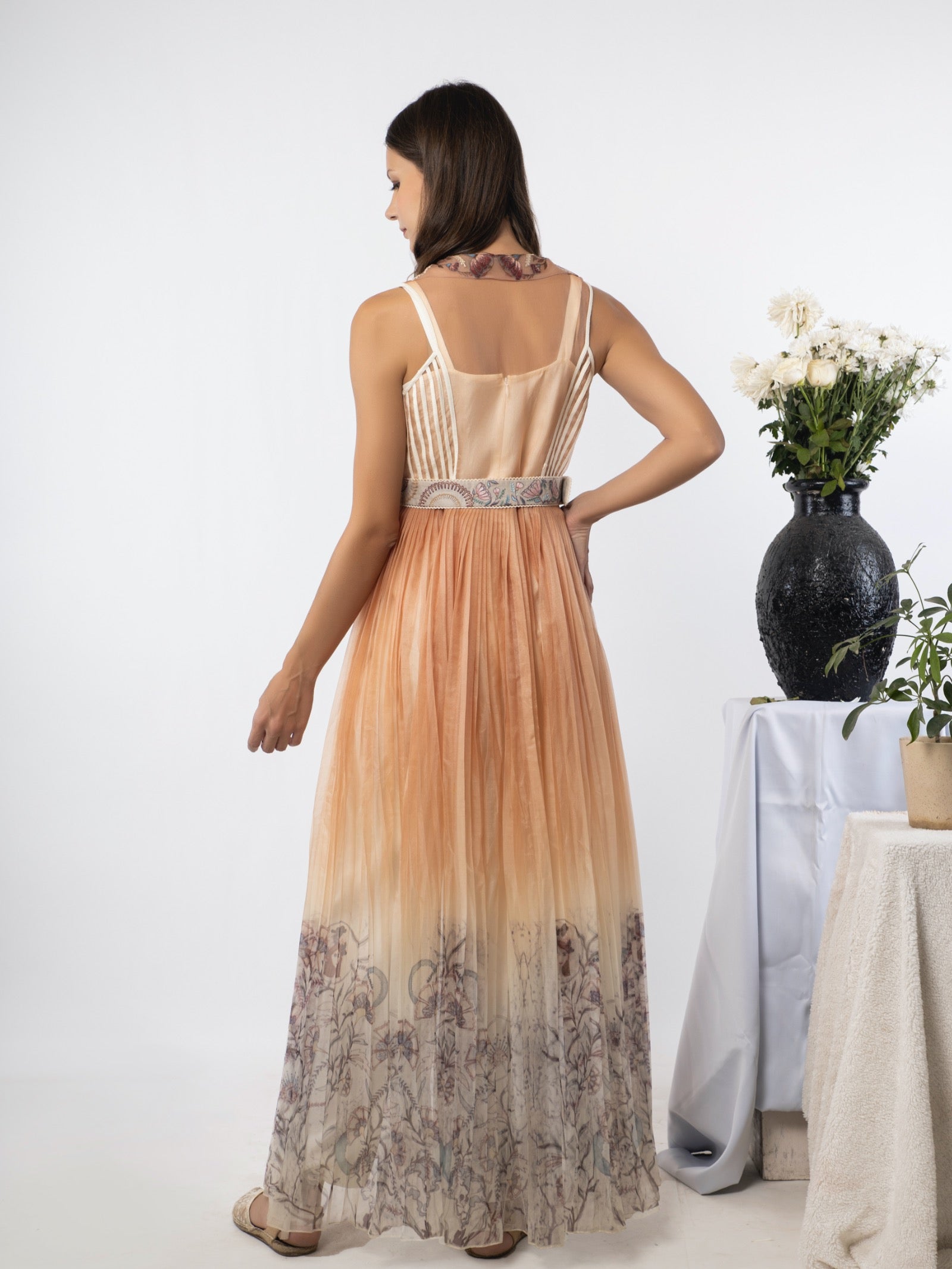 White jumpsuit with a sand-peach cape. image 3