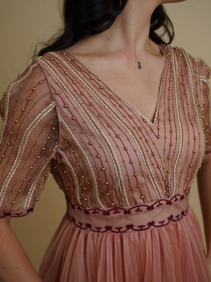 Golden galaxy embroidery in narrow pleated dress. image 1