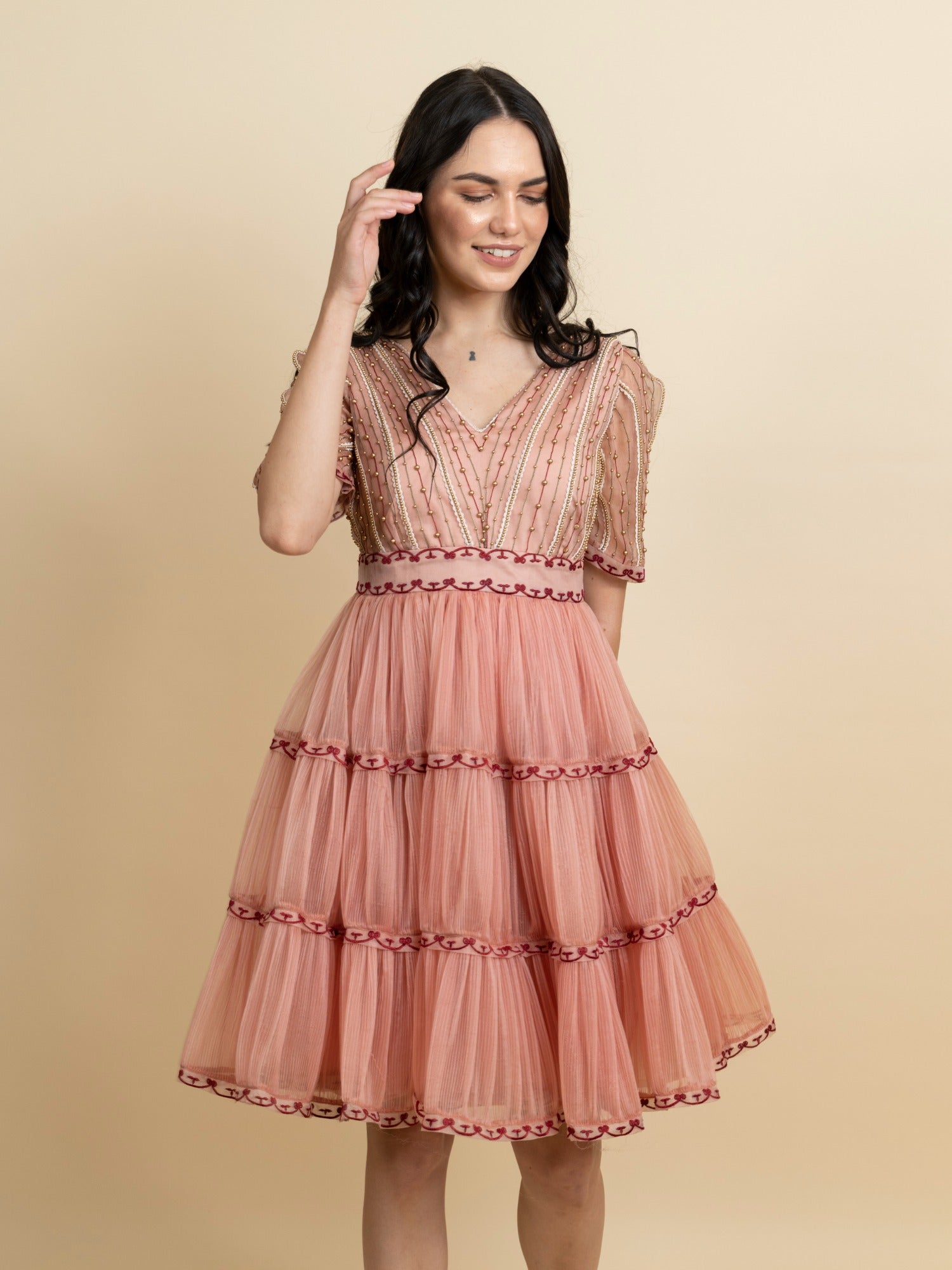 Golden galaxy embroidery in narrow pleated dress. image 2