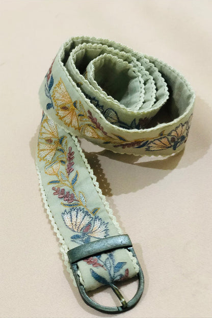 Green floral embroidered belt.