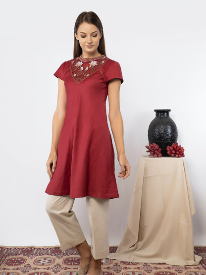 Red tunic with linen pants. image 1
