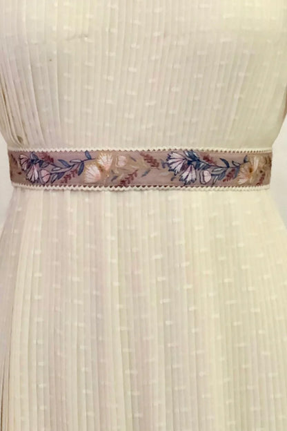 Green floral embroidered belt.