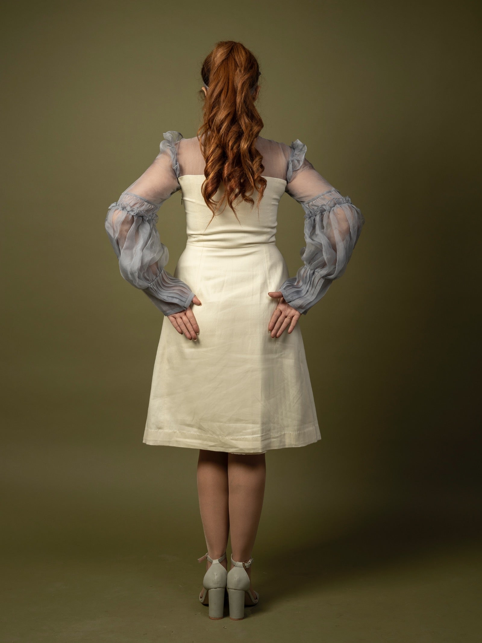 Off-white knee length dress. image 1