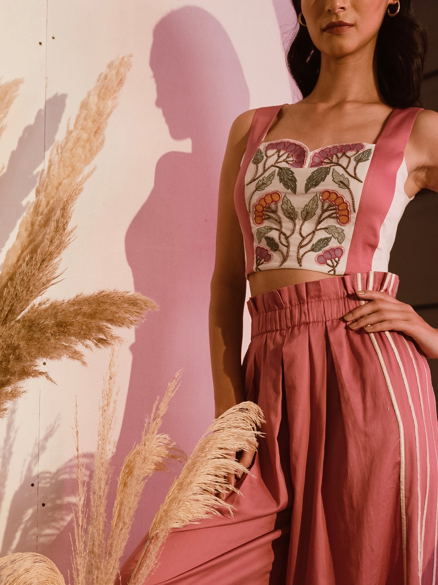 Embroidered crop top with pink flare pants image 0