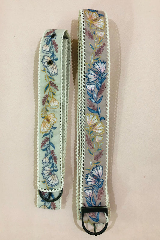 Green floral embroidered belt.