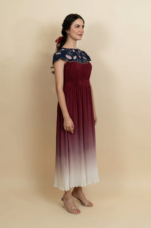 Floral embroidered neckline in a full length dress. (Blue)