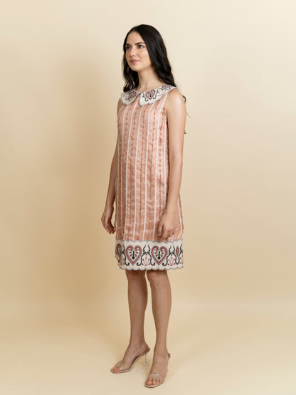 Galaxy embroidered knee length peach dress. image 0