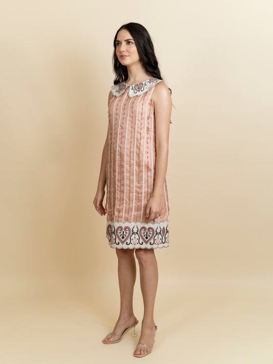 Galaxy embroidered knee length peach dress. image 0