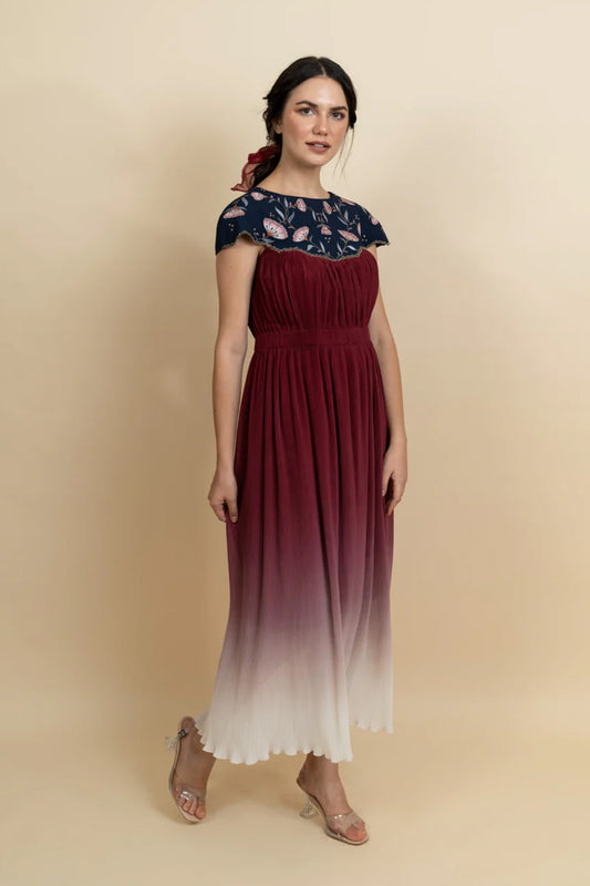 Floral embroidered neckline in a full length dress. (Blue)