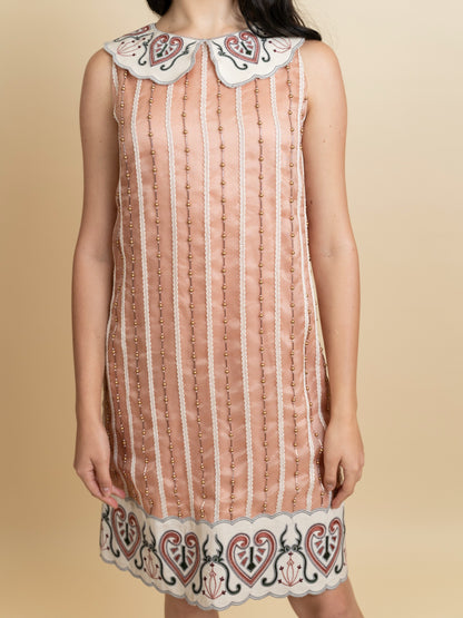 Galaxy embroidered knee length peach dress. image 1